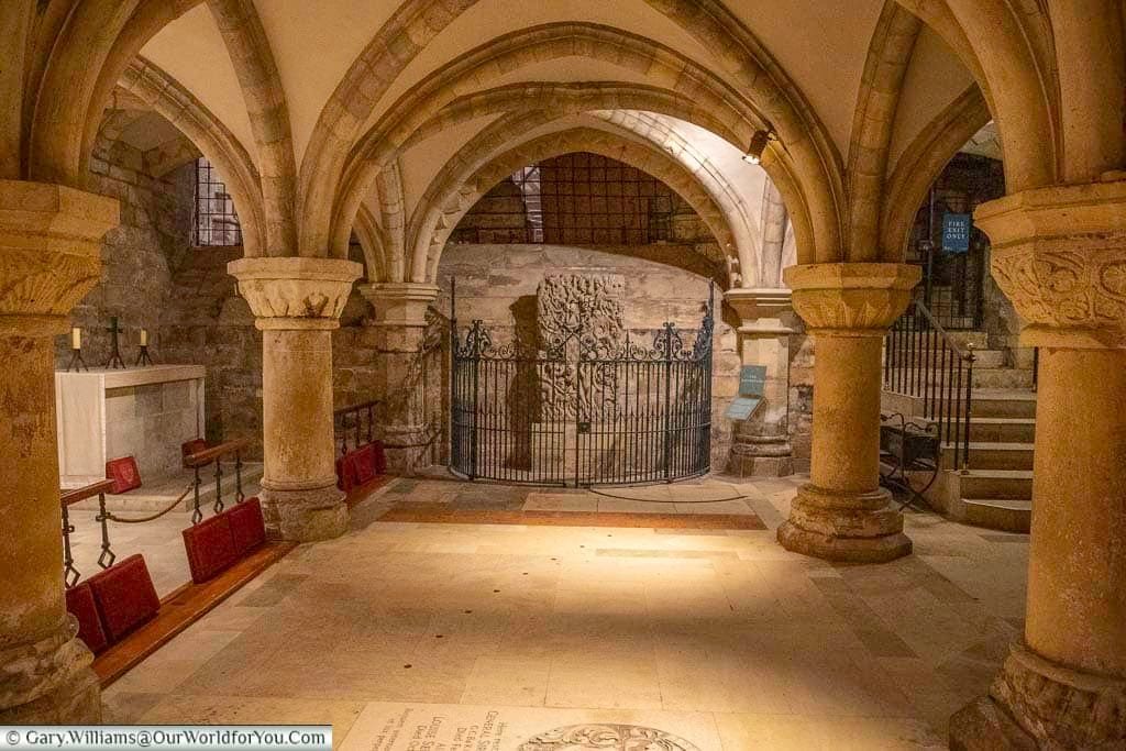 The atmospheric crypt of York Minster with Norman stone arches and historic relics. This ancient space reveals the cathedral’s deep history, making it an essential stop on a York heritage tour