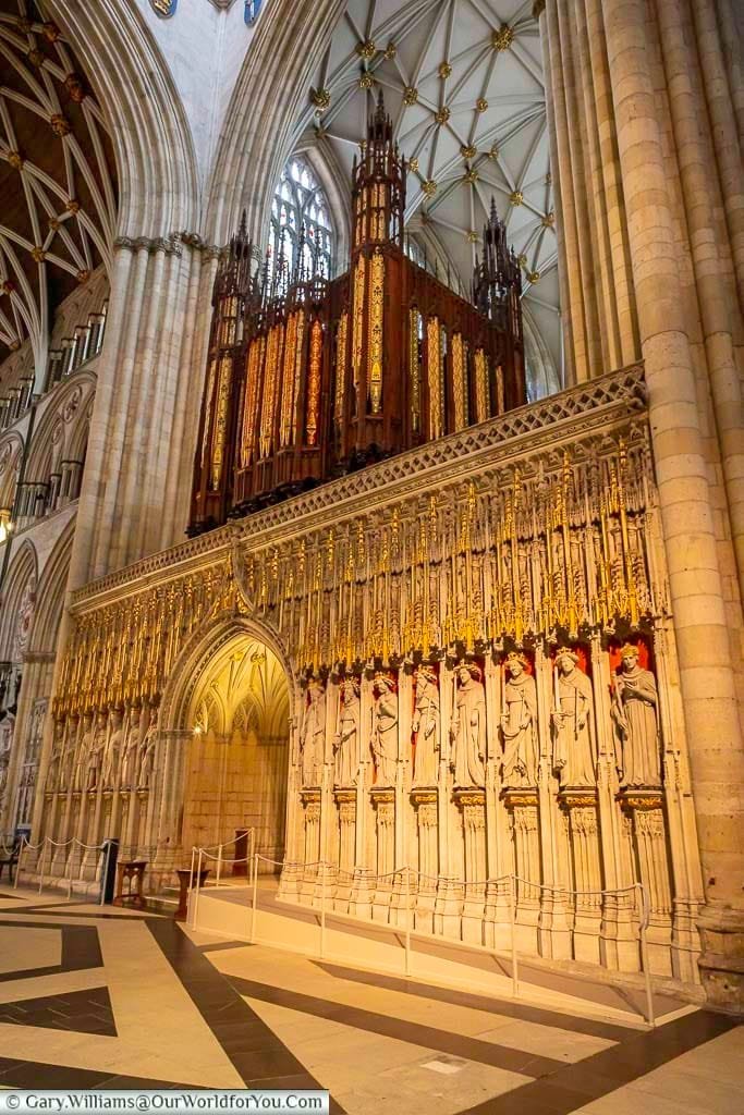 The King’s Screen at York Minster with detailed stone statues and the magnificent organ rising above. This masterpiece of craftsmanship is a central feature of the Minster and a must-see attraction for visitors to York