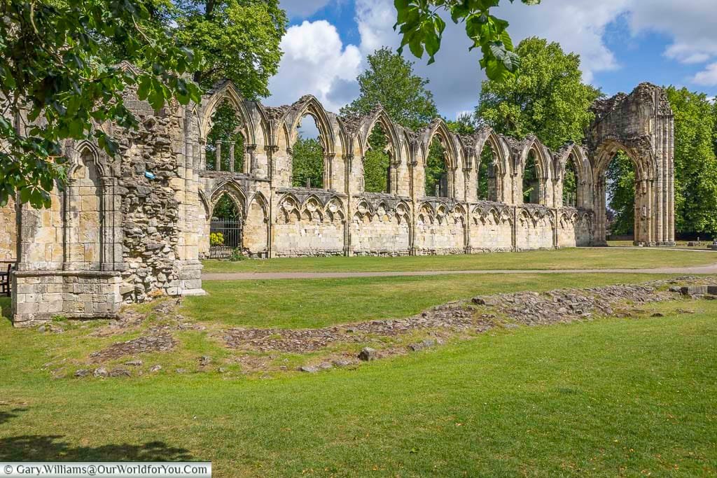 Gothic stone arches and crumbling walls of St. Mary’s Abbey stand proudly in York Museum Gardens, offering a glimpse into the city’s medieval past. This iconic York ruin is a highlight for sightseeing, photography, and heritage walks.