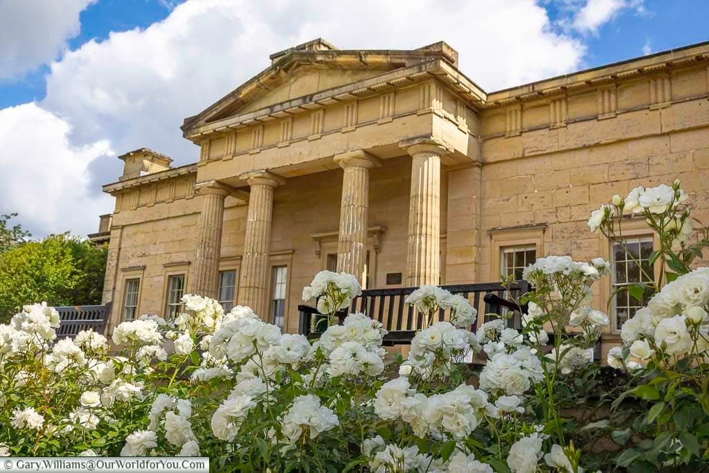 The neoclassical Yorkshire Museum in York, framed by white roses in bloom, highlights the city’s cultural heritage and archaeological treasures. A key attraction in York Museum Gardens, perfect for visitors interested in history and learning