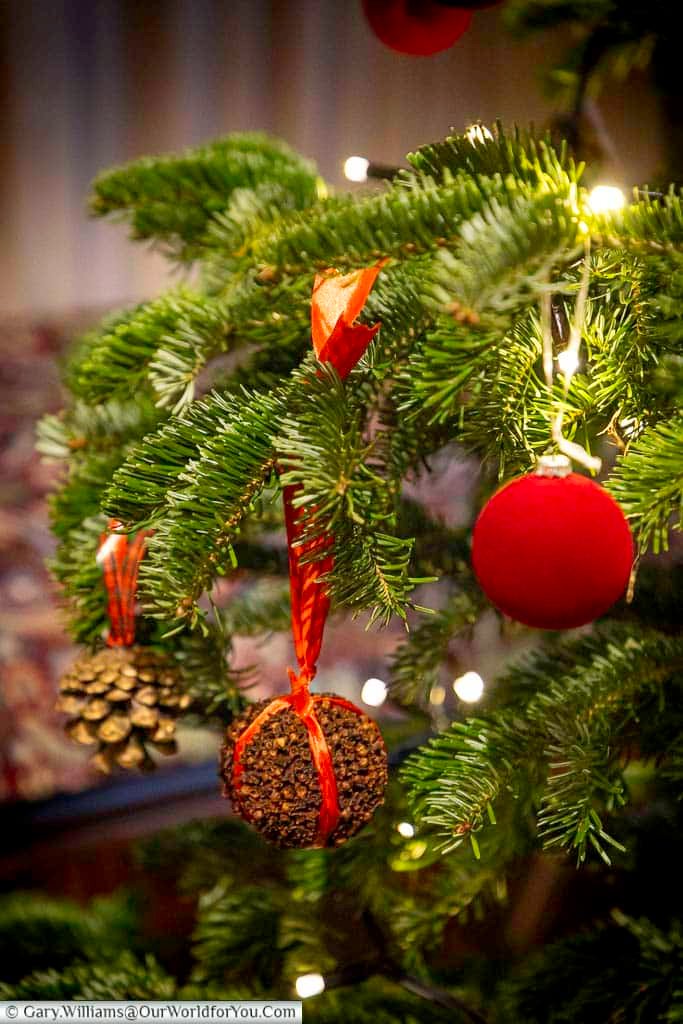 A traditional Tudor Christmas display fills one of Ightham Mote’s historic rooms, featuring carved woodwork, festive greenery and period furnishings. The scene evokes the warmth and pageantry of medieval Christmas celebrations in Kent.