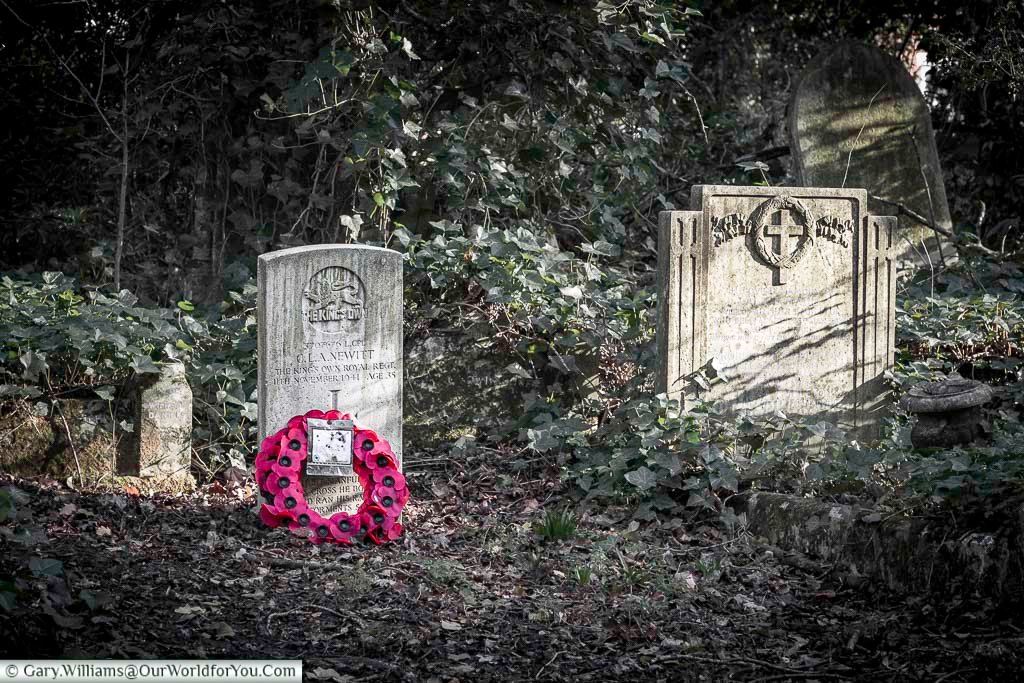 A solitary Second World War headstone stands among ivy-covered graves in Nunhead Cemetery, marked with military insignia and a simple cross. This moving image captures the personal cost of war within London’s historic burial grounds.