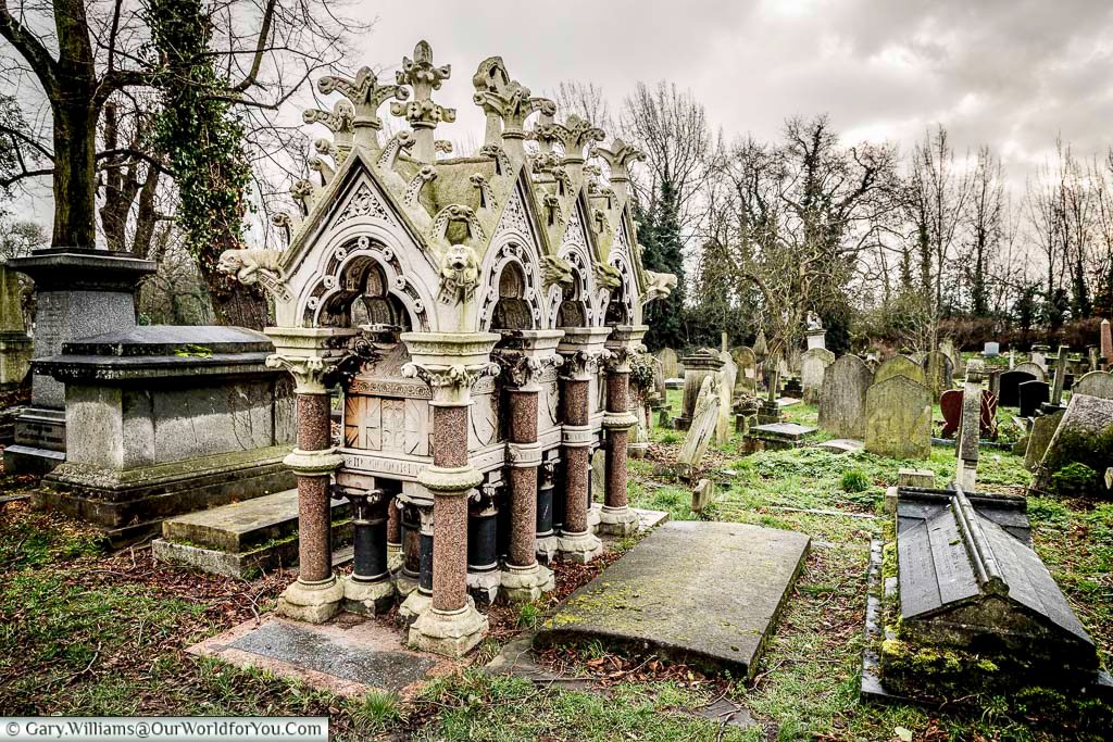 The raised tomb of Commander Charles Spencer Ricketts, of the Royal Navy, with its ornate canopy in Kensal Green Cemetery