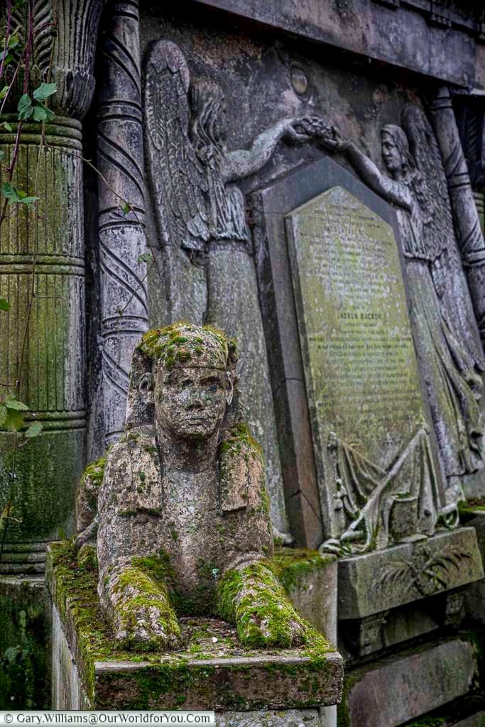A close-up of detail of the tomb of Andrew Ducrow focusing on the Egyptian sphinx guarding the entrance to the crypt.