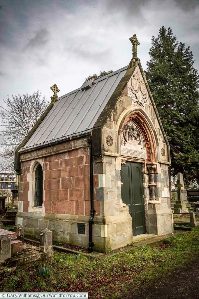 Historic O’Brien family mausoleum at Kensal Green Cemetery in London, built from stone with Gothic detailing, arched entrance, and carved religious symbolism. This atmospheric Victorian mausoleum highlights the rich funerary architecture and heritage of one of London’s most famous cemeteries.