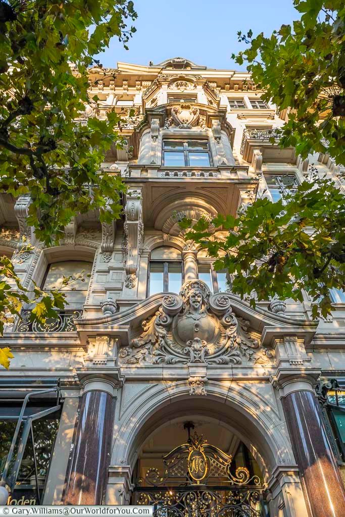 Intricately decorated historic building in Baden-Baden, framed by leafy trees and featuring sculpted stonework and arched windows. The architecture reflects the town’s 19th-century prosperity as one of Europe’s leading spa destinations.