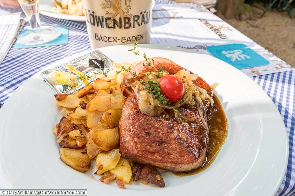 Traditional German meatloaf served with fried potatoes and gravy at a restaurant in Baden-Baden. Sampling local cuisine like this is an essential part of experiencing Baden-Baden’s food and beer culture.