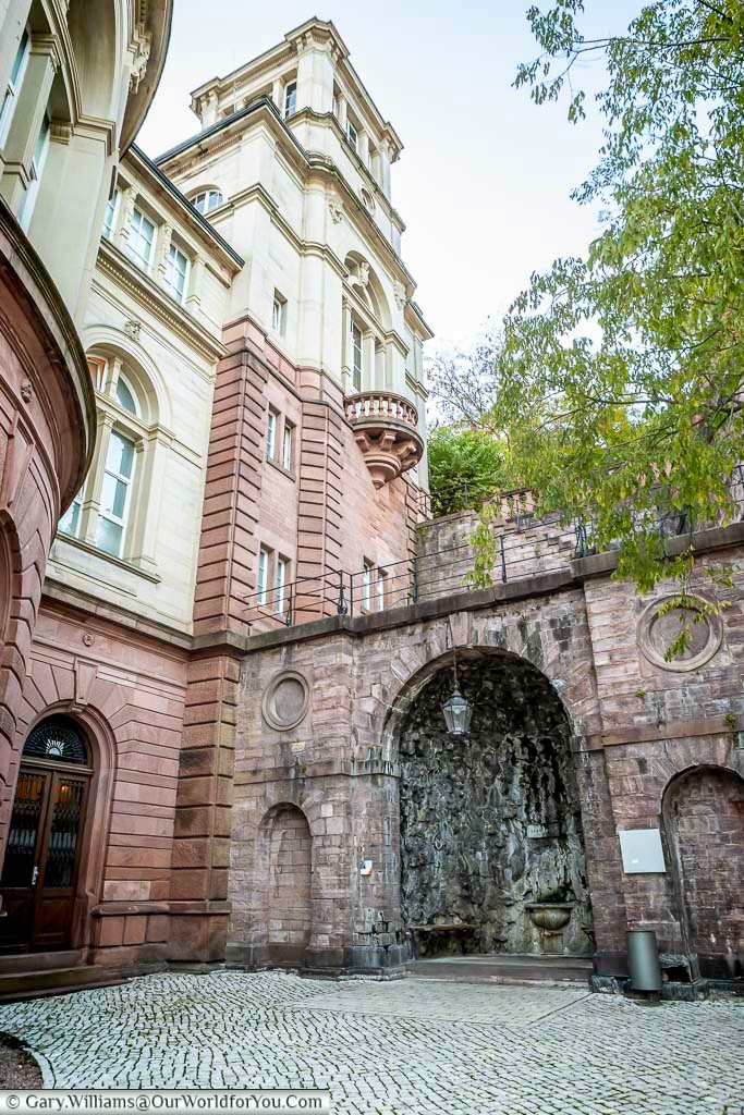 The historic Grotto Fountain in Baden-Baden, set beneath elegant spa architecture, reflects the town’s long tradition as a refined European spa destination. This hidden corner is a charming stop on a Baden-Baden walking tour through Germany’s Black Forest spa town.