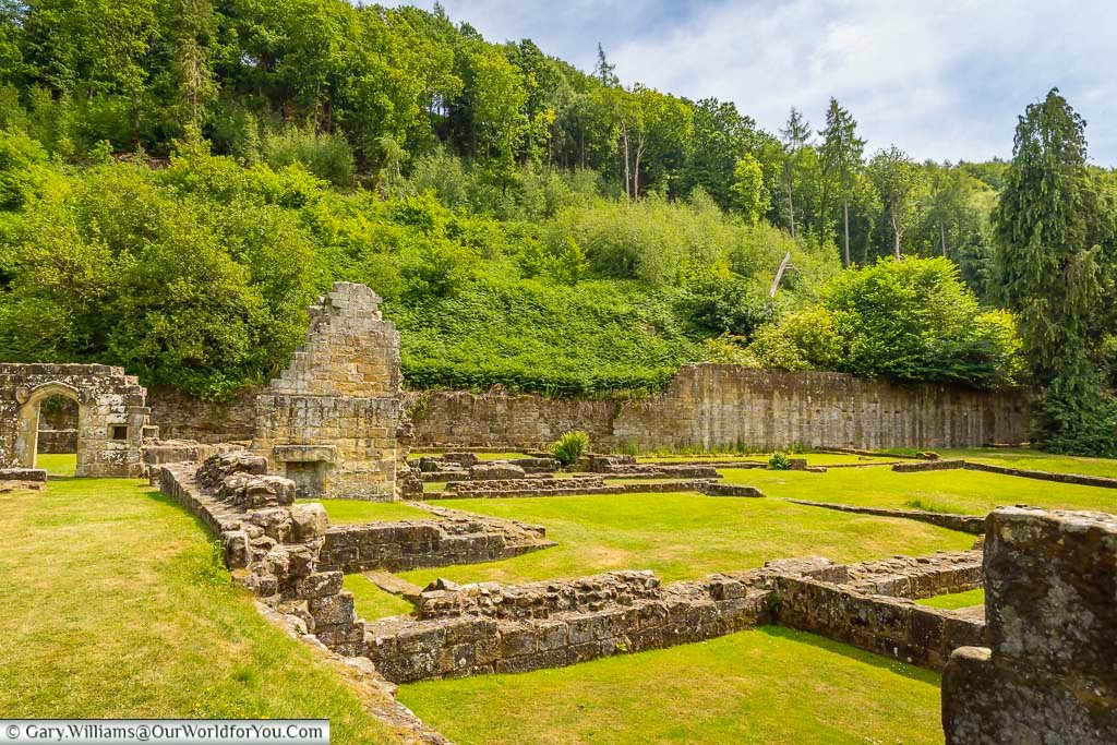 The stone foundations and ruins of Mount Grace Priory reveal the scale of this once grand Carthusian monastery in North Yorkshire. Visitors can walk through the remains and imagine medieval monastic life in this historic English heritage site.