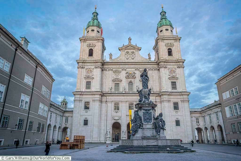 Salzburg Cathedral viewed from Domplatz, showcasing its grand Baroque façade and twin towers under a dramatic sky. Located in the heart of the Old Town, the cathedral is one of Salzburg’s most important historic and religious landmarks.