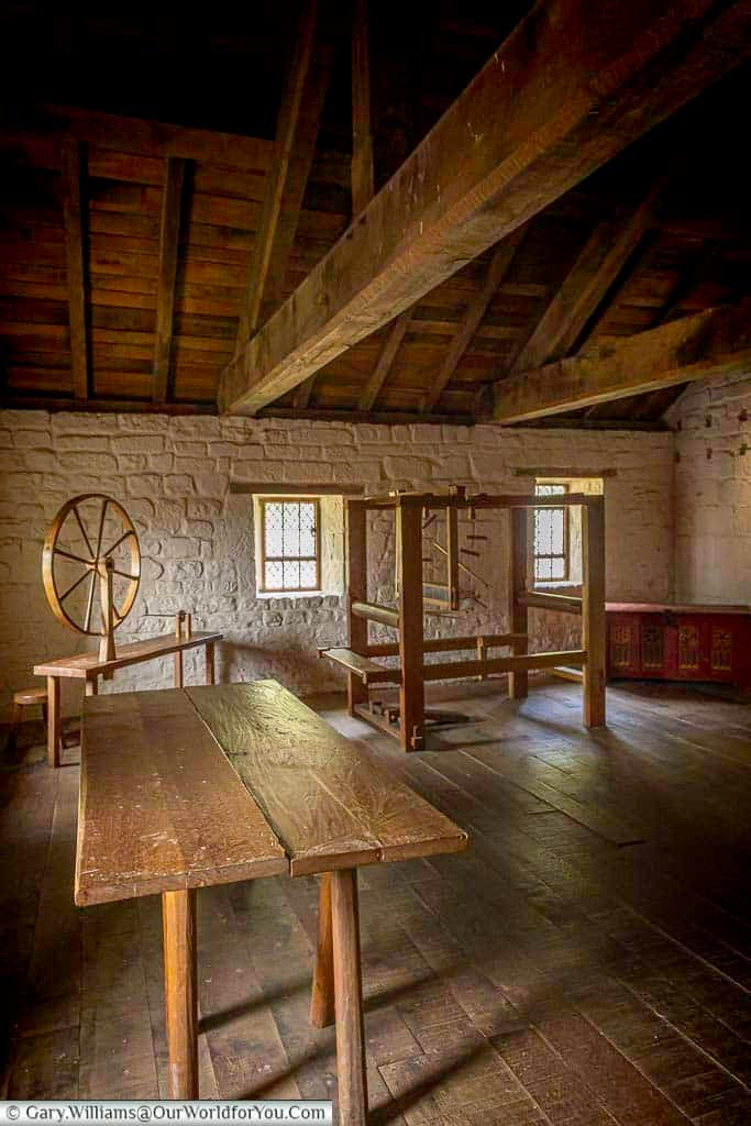 An atmospheric upper room inside a Carthusian monk’s cell at Mount Grace Priory, with timber beams, wooden furniture, and traditional medieval furnishings. This historic space highlights the daily working life of monks at one of Yorkshire’s most unique monastic ruins.