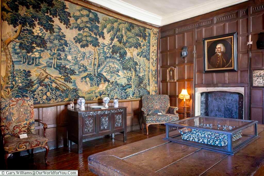A grand Flemish wall tapestry decorates a wood-panelled room at the Treasurer’s House in York. This richly detailed historic interior highlights one of the finest National Trust properties in York near York Minster.