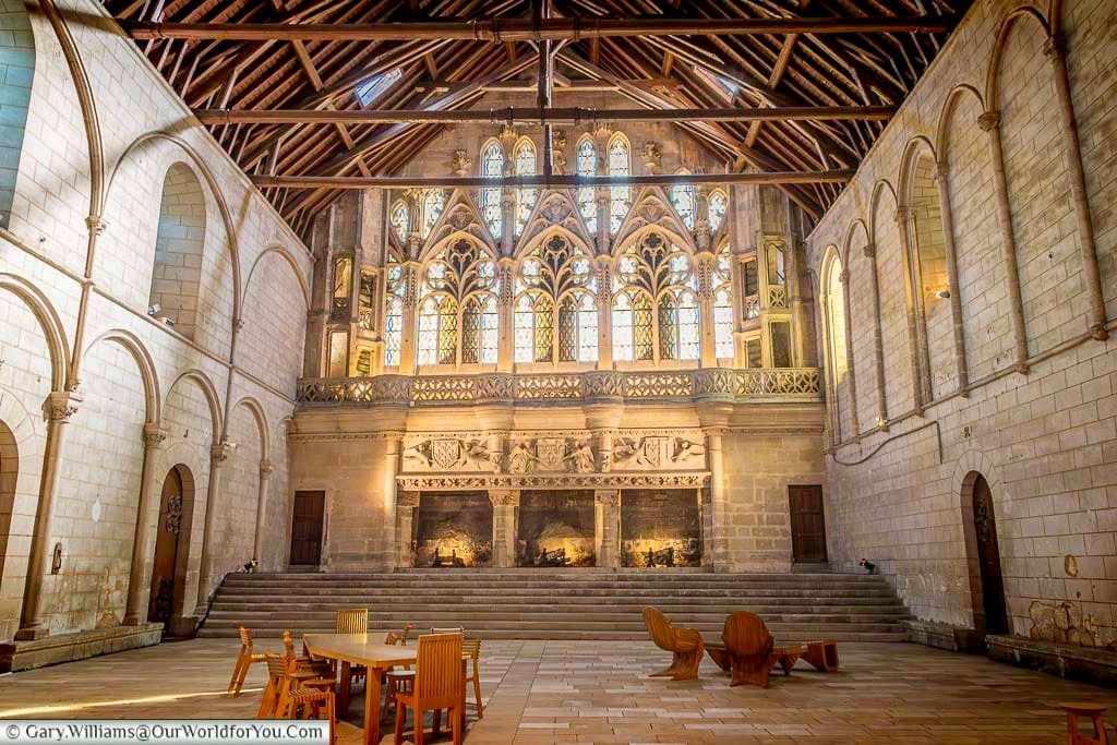 The magnificent Salle des Pas Perdus inside the Palace of Poitiers features soaring timber beams and Gothic windows. This historic hall is one of the largest surviving medieval civic spaces in Europe and a highlight when visiting Poitiers.