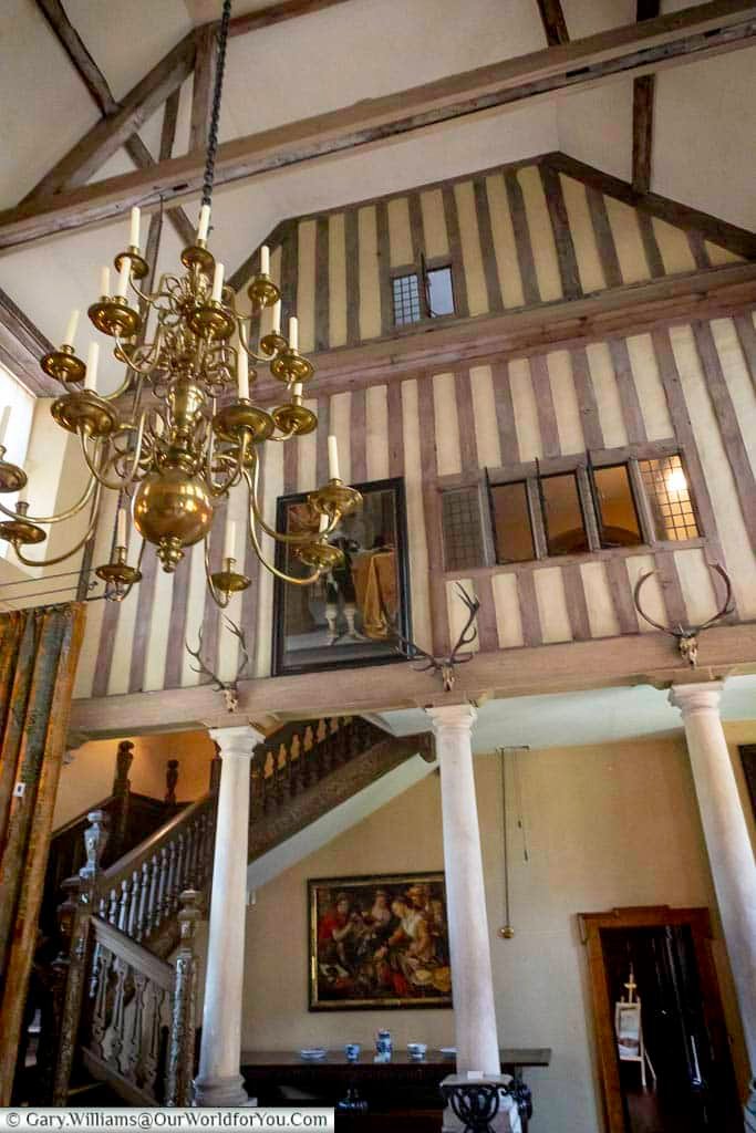The timber-framed Great Hall at the Treasurer’s House in York features exposed beams, a grand chandelier and carved staircase. This striking medieval interior highlights the architectural heritage of one of York’s finest National Trust properties.