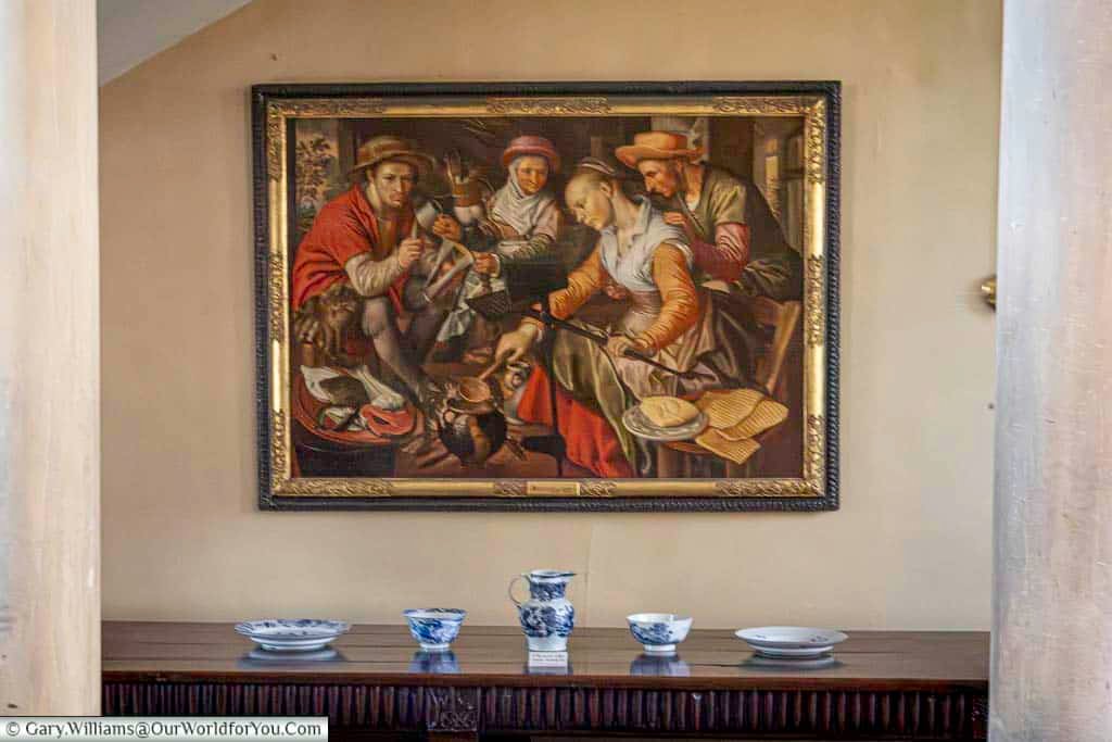 “A Dutch Kitchen Scene” by Joachim Beuckelaer hangs prominently within the Treasurer’s House in York. This vibrant Renaissance painting adds artistic depth to the collection displayed at this notable National Trust property in Yorkshire.