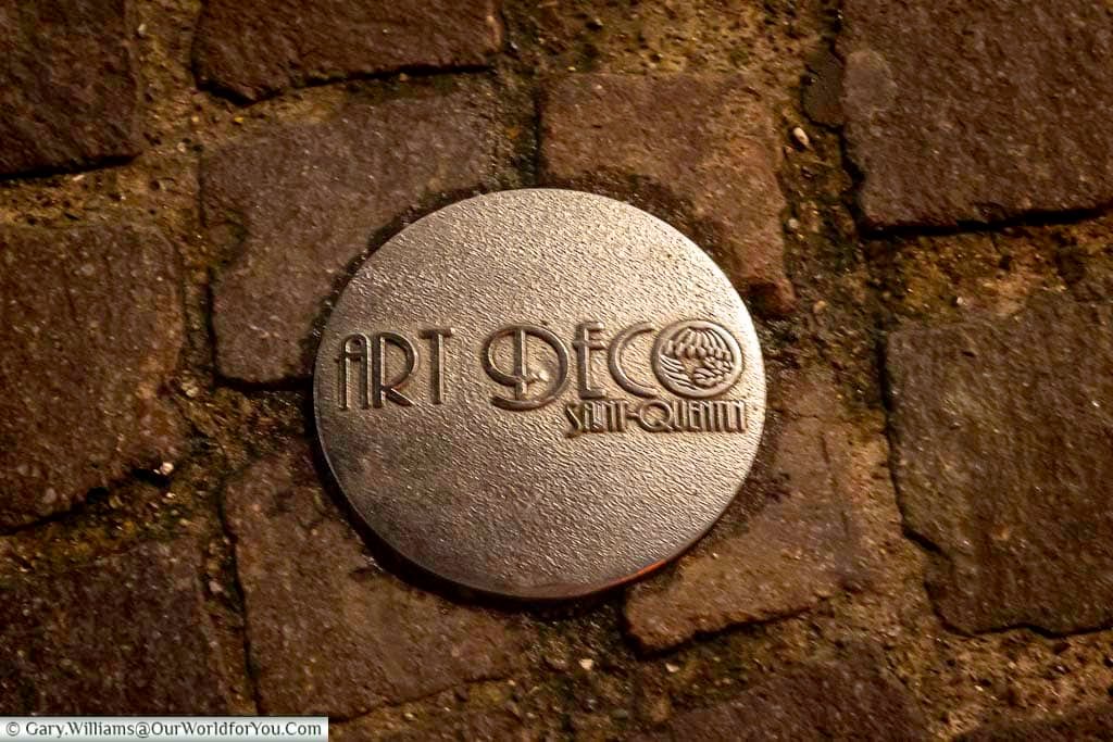 A close-up of an Art Deco plaque embedded in the streets of Saint-Quentin marks the city’s famous architectural walking route through its historic centre. These unique markers guide visitors to some of the finest Art Deco landmarks in France, making Saint-Quentin a hidden gem for cultural tourism and design enthusiasts.