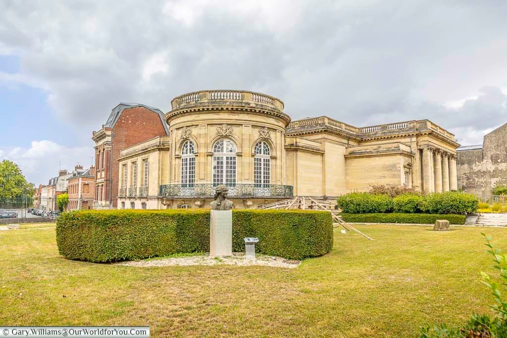 The Musée Antoine Lécuyer in Saint-Quentin, France, is an elegant neoclassical museum surrounded by landscaped gardens and historic architecture under dramatic skies. This cultural landmark is one of the top attractions in Saint-Quentin, offering visitors a chance to explore fine art, French heritage, and the rich history of northern France.