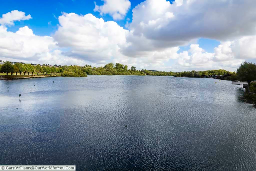 A tranquil view of the River Somme near Saint-Quentin shows calm waters, lush greenery, and expansive skies in the scenic French countryside. This peaceful natural setting is ideal for travellers seeking outdoor activities, riverside walks, and relaxing escapes during a French road trip or Saint-Quentin city break.