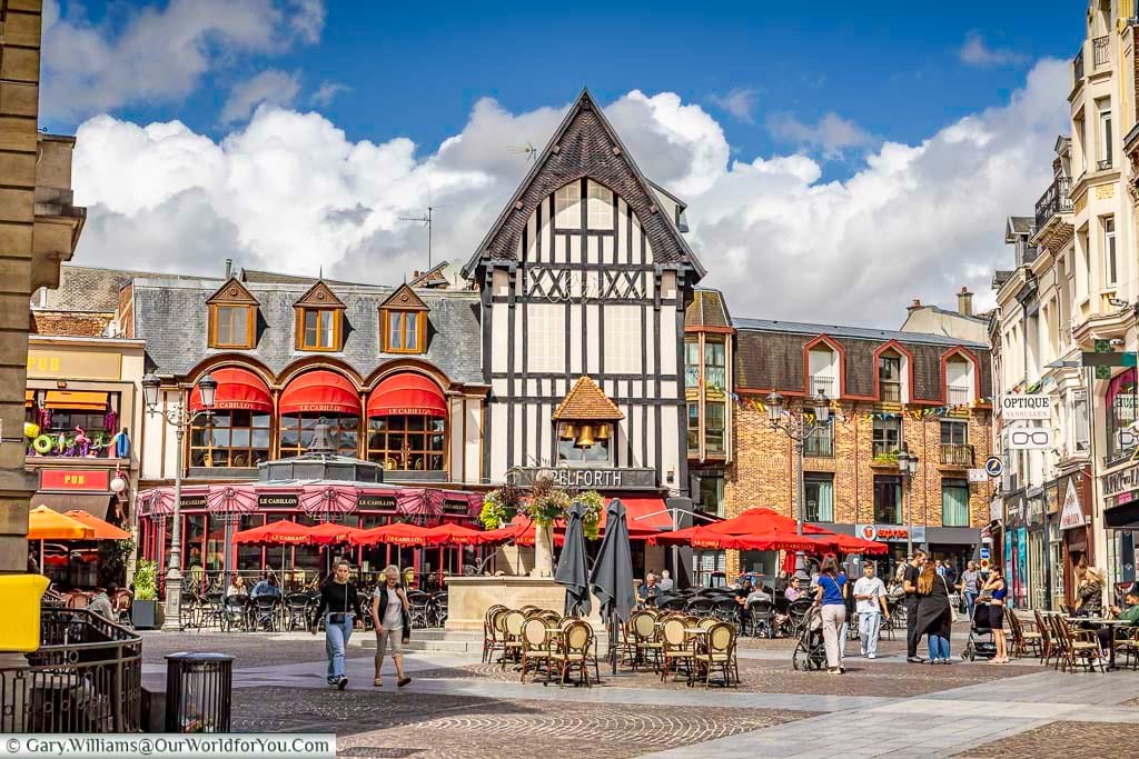 The lively Rue de Petit Butin in Saint-Quentin features charming historic buildings, bustling cafés, and colourful storefronts in the heart of the city centre. This picturesque street captures the atmosphere of a traditional French city break and is ideal for travellers exploring local culture and architecture in northern France.