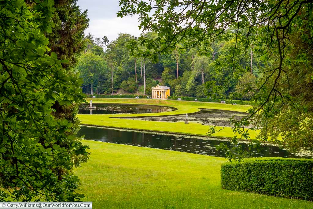 Scenic gardens and waterways at Studley Royal Water Garden in Yorkshire, featuring manicured hedges, stone bridges and classical statues surrounded by woodland. This elegant National Trust landscape is one of the most picturesque places to visit in Yorkshire and a perfect escape into nature and history.