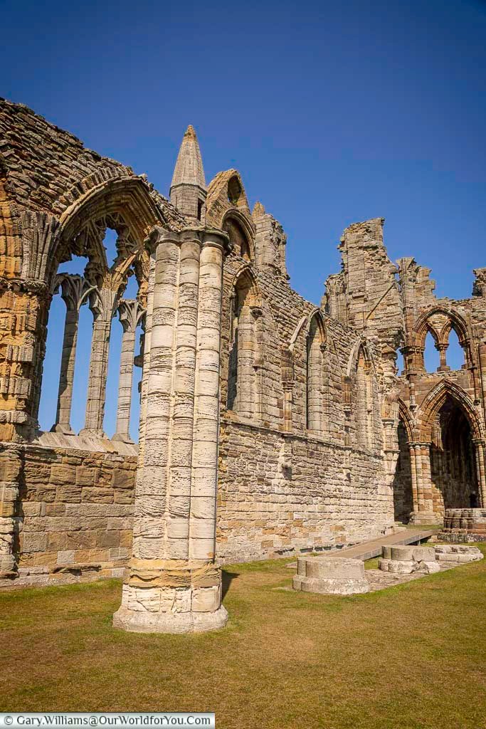 The nave of Whitby Abbey features dramatic Gothic arches and towering stone columns that have stood for centuries overlooking the North Sea. This iconic section of the abbey is one of Whitby’s most photographed landmarks and a highlight of any Yorkshire heritage tour.
