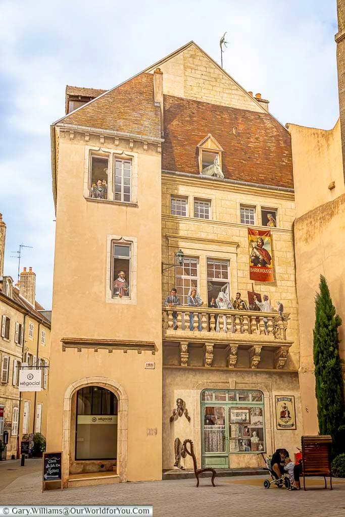 A colourful trompe-l'œil mural depicts famous figures from Dole’s history, transforming a historic building façade into an eye-catching work of public art. This creative landmark is one of the town’s hidden attractions and a fascinating stop on a walking tour of Dole.