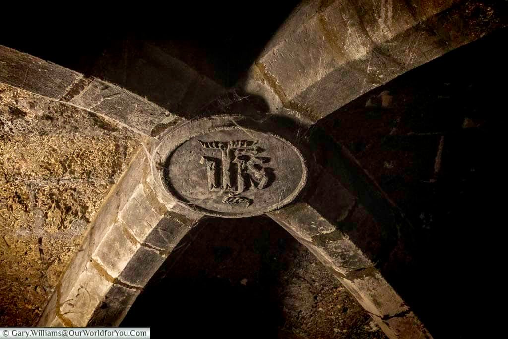A carved stone emblem decorates the vaulted ceiling of one of Chambéry’s atmospheric historic passageways in the old town. These hidden architectural details reveal the fascinating medieval character found while exploring Chambéry, France.