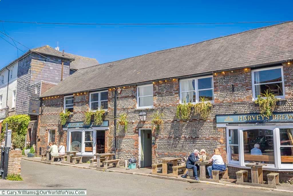 The flint-and-brick John Harvey Tavern beside Harvey’s Brewery, a wonderfully characterful Lewes pub with tables spilling out into the sunshine.