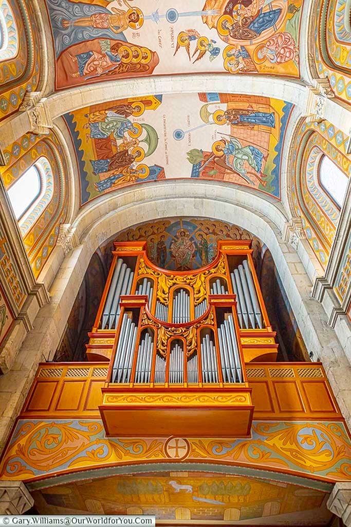 The impressive pipe organ and richly painted vaulted ceiling inside Saint-Nazaire Church, Sanary-sur-Mer.