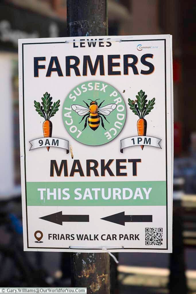 A sign advertising Lewes Farmers Market, where local Sussex producers bring food and produce into the town and continue Lewes’s strong market tradition.
