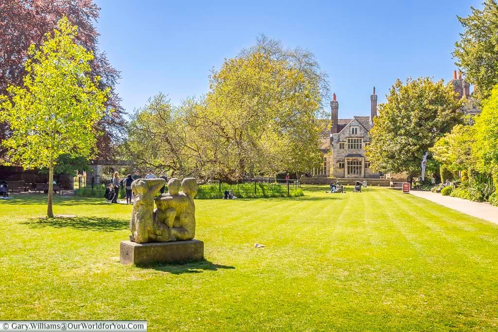 The peaceful lawns of Southover Grange Gardens, with sculpture, mature trees and historic Southover Grange creating one of Lewes’s loveliest green spaces.