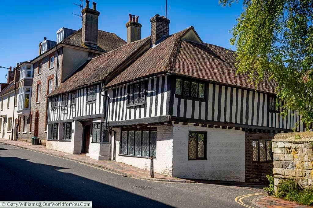 Traditional houses lining Southover High Street in Lewes, including a striking timber-framed building that reflects the rich architectural heritage of the neighbourhood.