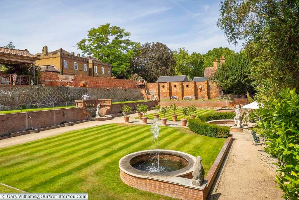 The beautifully restored formal gardens at Restoration House in Rochester, Kent, feature manicured lawns, elegant fountains, classical statues and historic brick walls. This peaceful hidden garden in the heart of historic Rochester offers a colourful glimpse into one of Kent’s lesser-known heritage attractions.