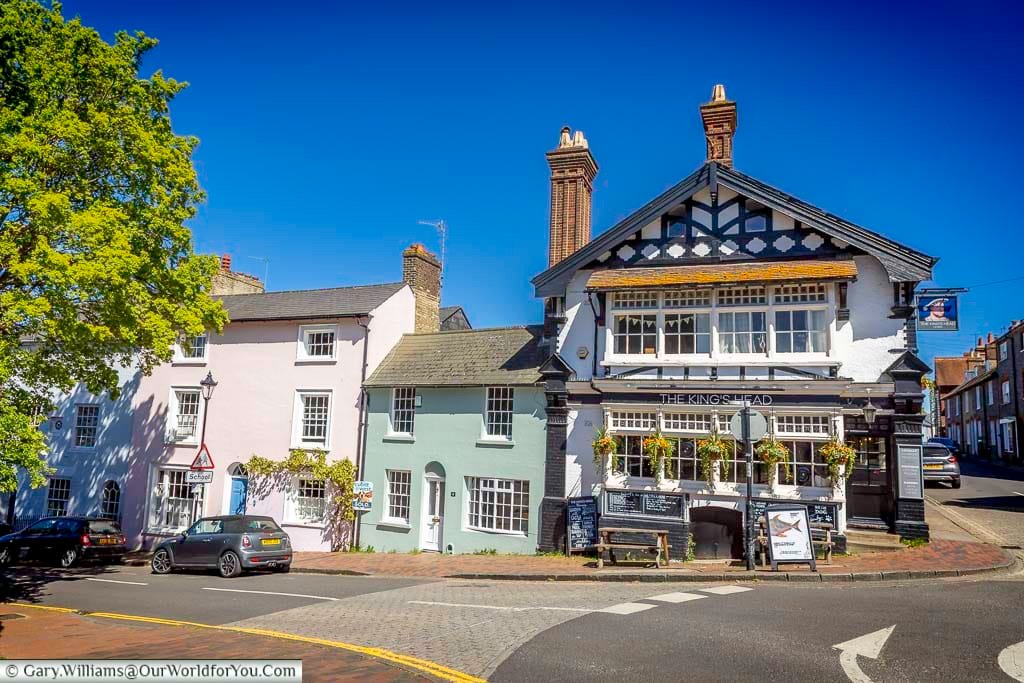 The traditional King’s Head pub on Southover High Street in Lewes, surrounded by colourful historic houses beneath a wonderfully clear Sussex sky.
