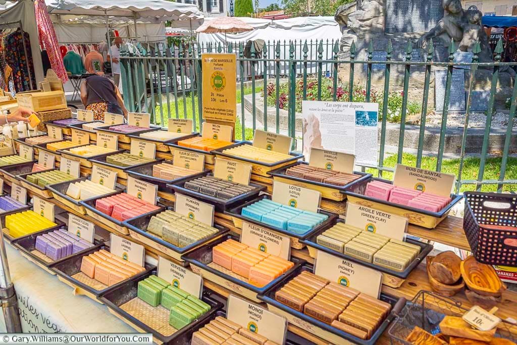 Colourful selection of traditional Provençal soaps, including lavender, rosemary and orange blossom, at Saint-Rémy-de-Provence market.