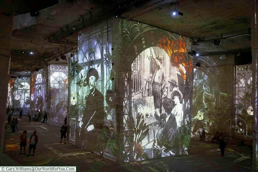 Immersive art projections covering the vast limestone walls and pillars inside Carrières des Lumières at Les Baux-de-Provence.
